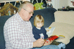 Pop reading Caillou to Maeve