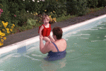 Jeanne throwing Hilde in the pool