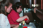 Jill and Elaine giving Maeve a bath